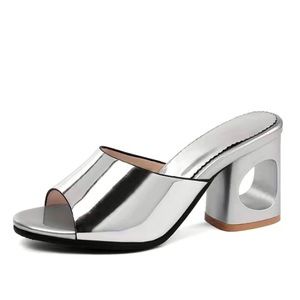 Sculptural silver heels size 7.5